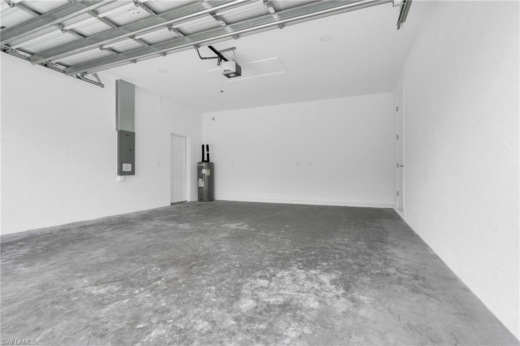 Garage with electric panel and electric water heater