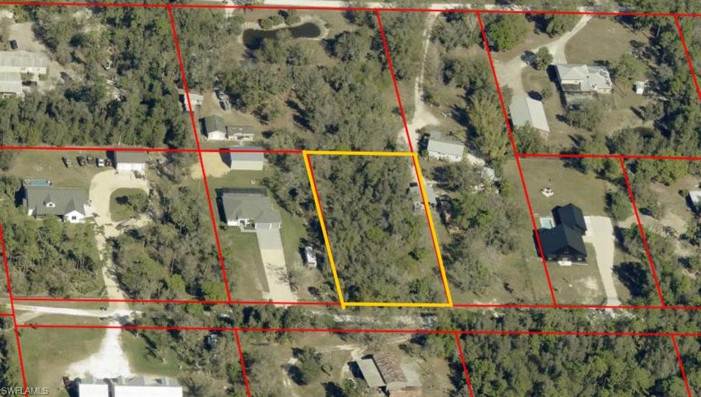 Aerial View with Property Boundary. Depicting the designated property within a larger land area