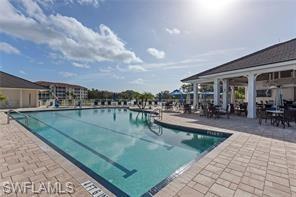 Community pool with a patio area