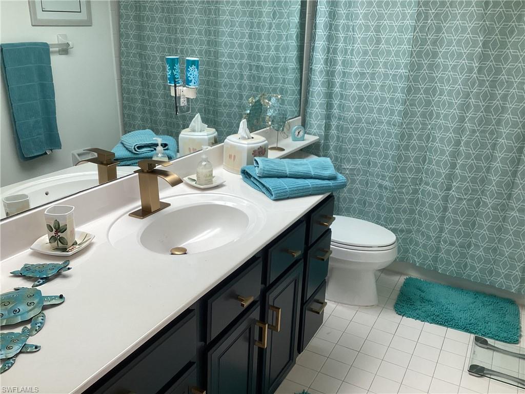 Bathroom featuring vanity and light tile patterned flooring