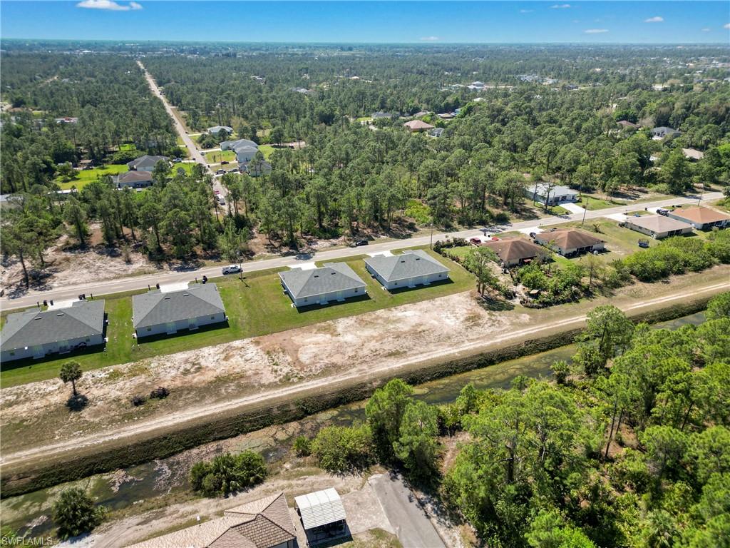 Aerial view featuring a forest view
