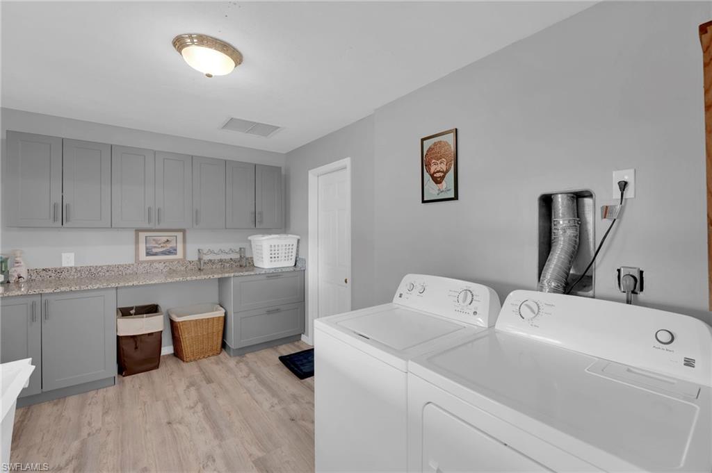 Over sized laundry room with more cabinet space!
