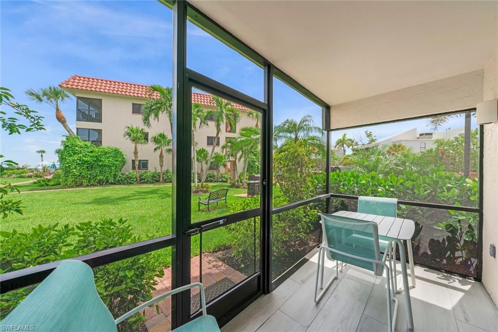 Screened patio featuring wood-finish tile flooring, a solid ceiling, and black frame screening
