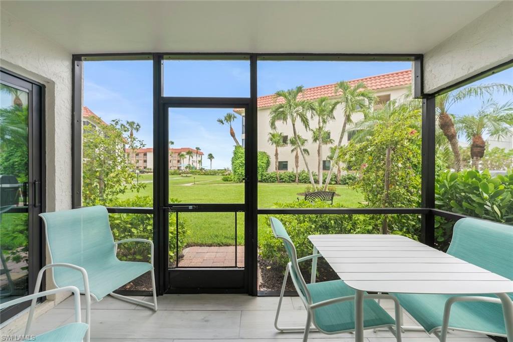 Screened-in patio with light-toned tile flooring