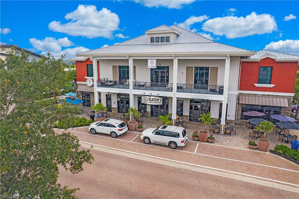 Slater’s Goods & Provisions and The Hatchery at the town center, offering walkable dining and retail with covered balconies and outdoor patio seating.