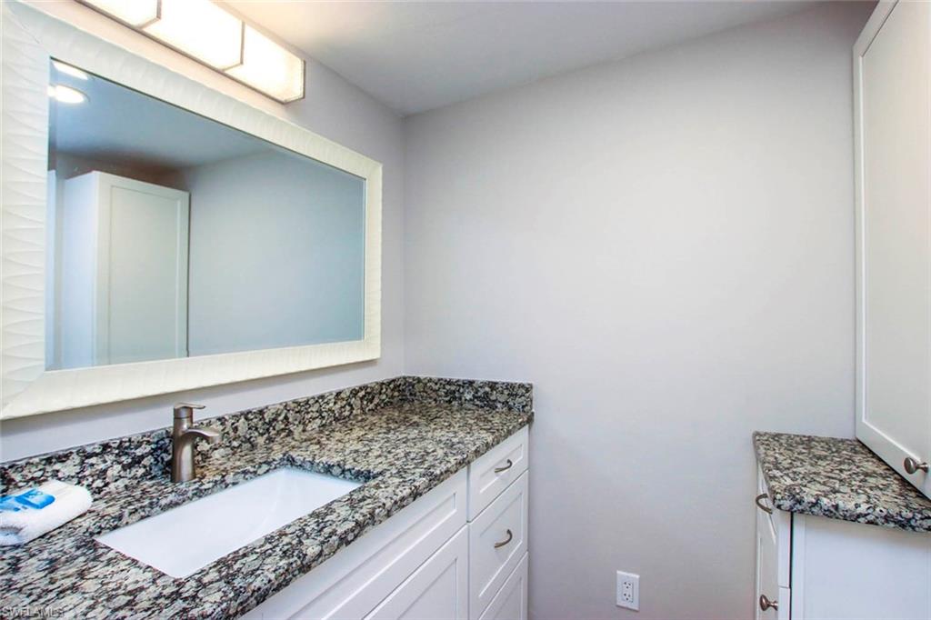 BATH 3 IS LOCATED ON THE MAIN LEVEL.  UPDATED CABINETS AND COUNTERTOPS.