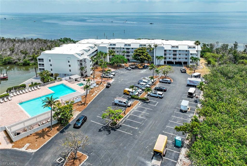 Bay, Bayside Villas, Parking Area, Community Pool & Spa surrounded by native landscaping.