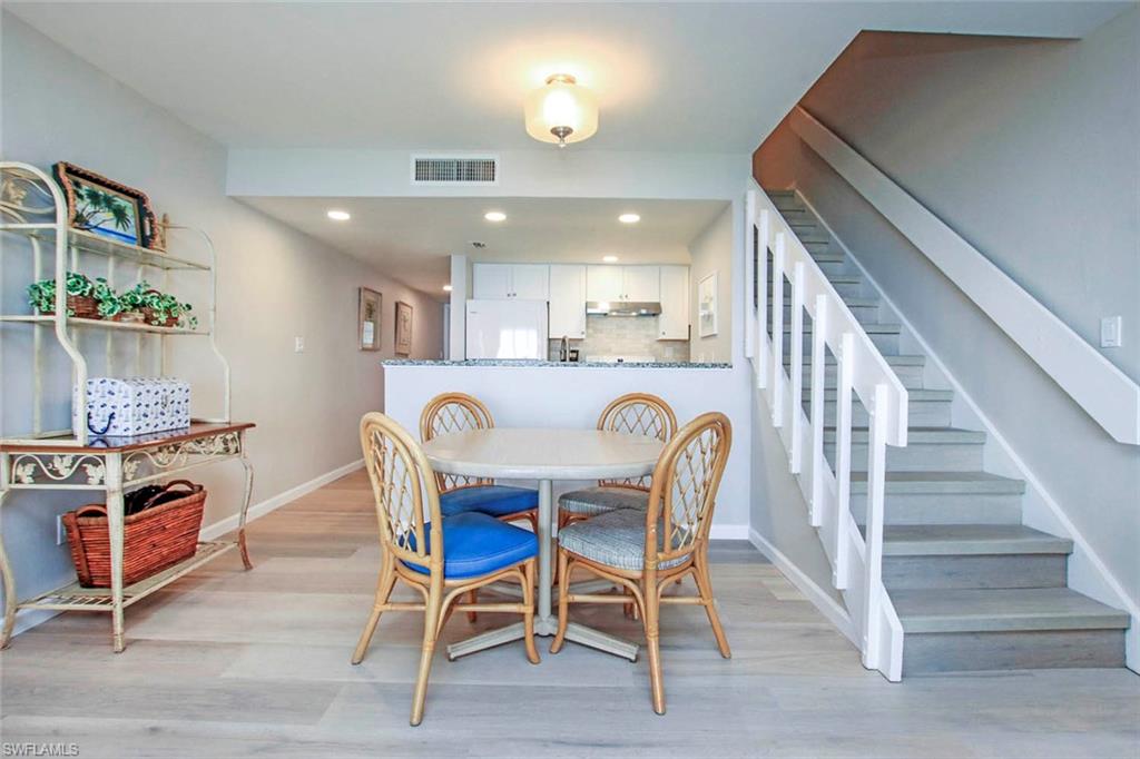 Open Floor Plan. DINING Area.  Stairs to 2nd Floor Bedrooms, Baths & Laundry Area.
