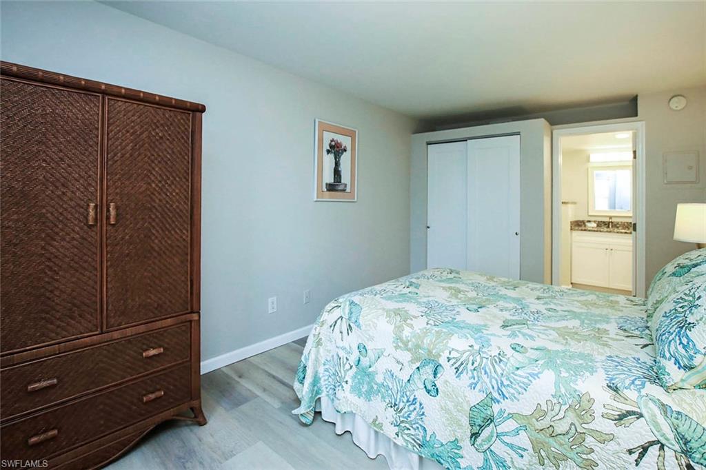 BEDROOM 3 IS LOCATED ON THE FIRST LEVEL.  LIGHT WOOD STYLE FLOORING, DOUBLE CLOSET (ADDED MARCH, 2024), AND HIGH END WOOD TRIM AND SOLID WOOD DOORS.