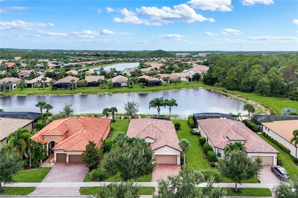 Community with abundant green spaces, mature landscaping, and waterfront properties