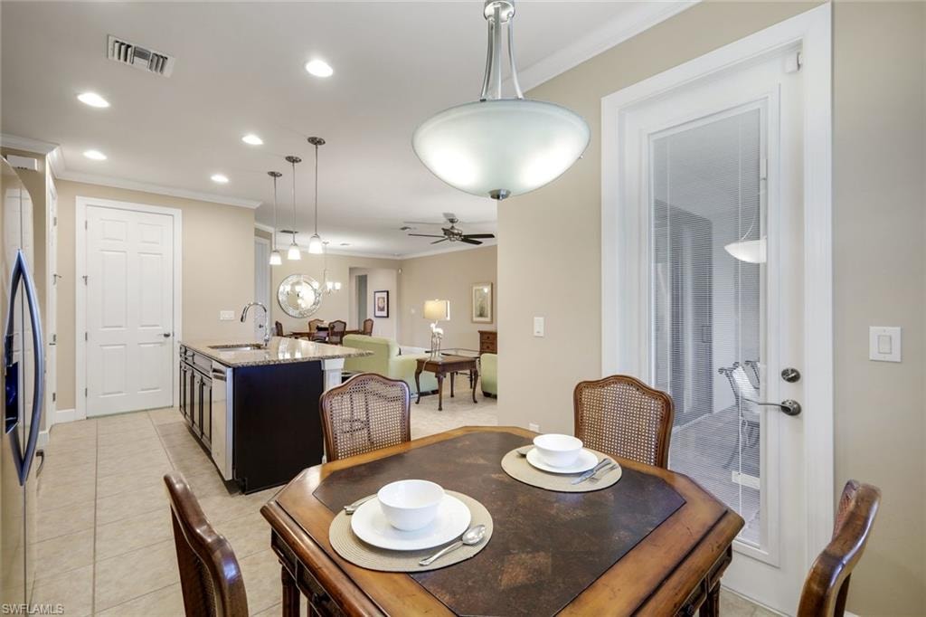 Open concept living space with recessed lighting, pendant lighting, and a ceiling fan