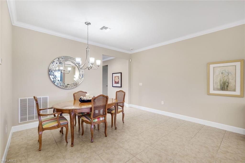 Tile flooring, crown molding, chair rail, and recessed lighting