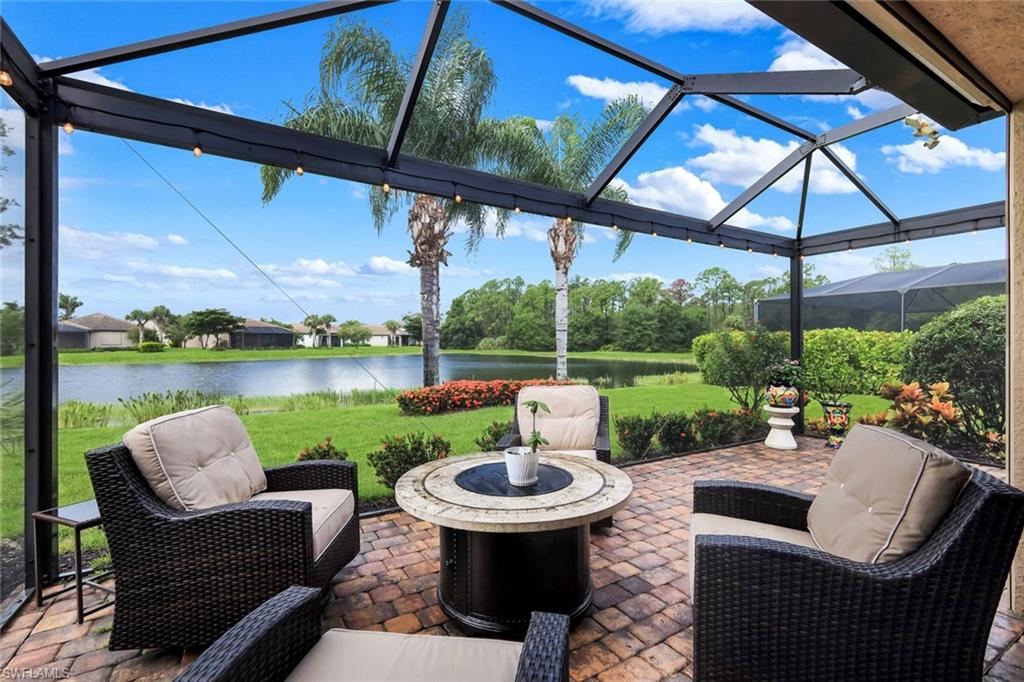 Screened lanai featuring a paver patio and string lighting