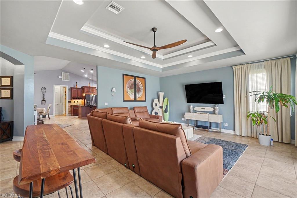 Tray ceiling with recessed lighting and a ceiling fan