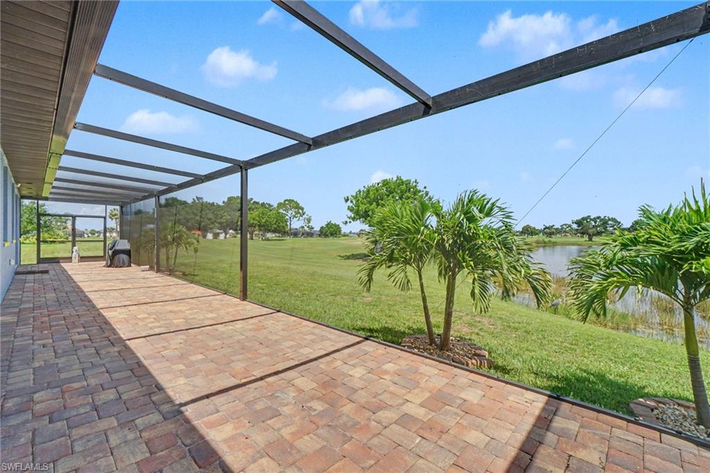 Screened patio featuring multi-toned paver flooring