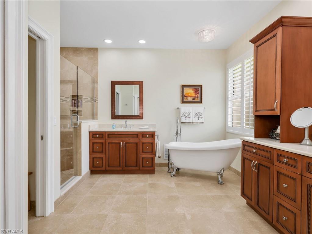 Two vanity sinks, separate tub and shower
