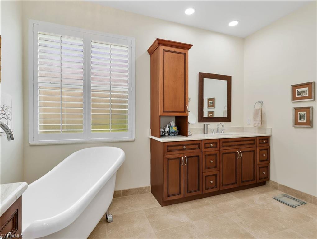Two vanity sinks, separate tub and shower