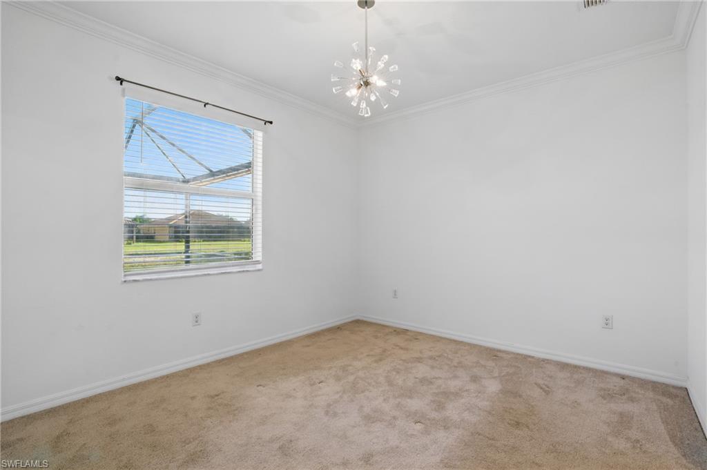 Room featuring neutral carpeting, a large window with horizontal blinds, and a contemporary ceiling light fixture