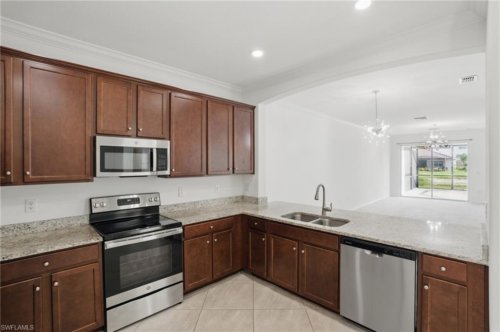 Kitchen featuring wood cabinetry, and stainless steel appliances
