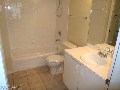 Full Bathroom with Vanity Sink and FixtureThis bathroom features a spacious vanity with dual-basin sink and ample counter space, chrome faucet fixtures, and abundant storage cabinetry