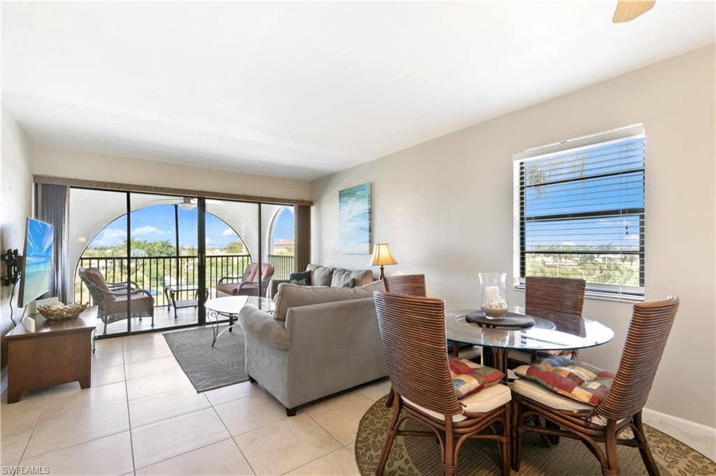 Dining room with a healthy amount of sunlight and light tile floors