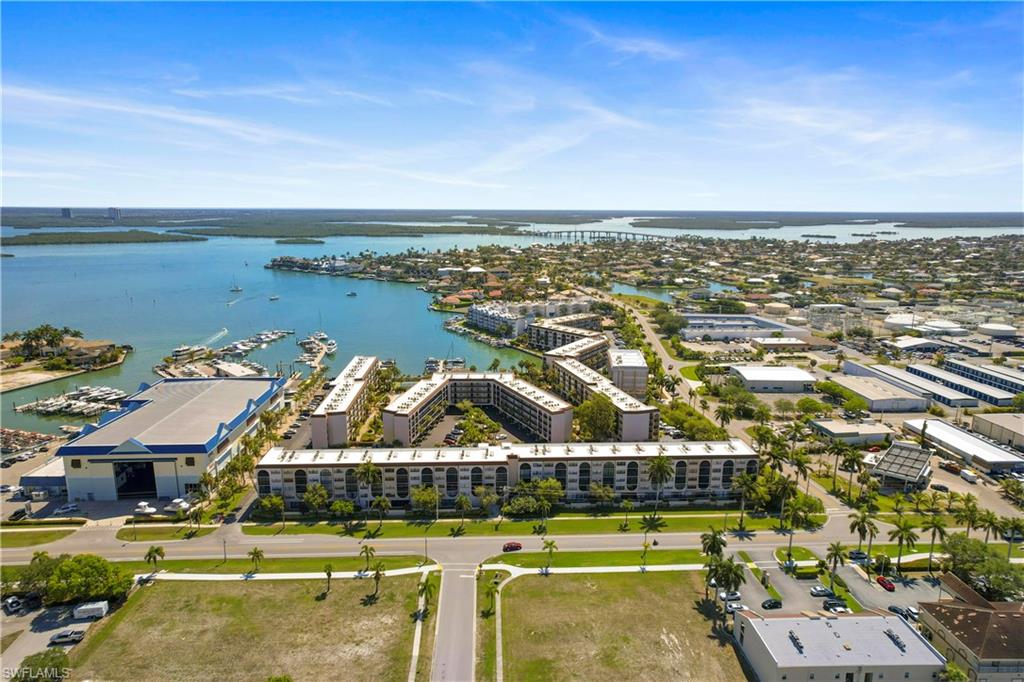 Birds eye view of property with a water view