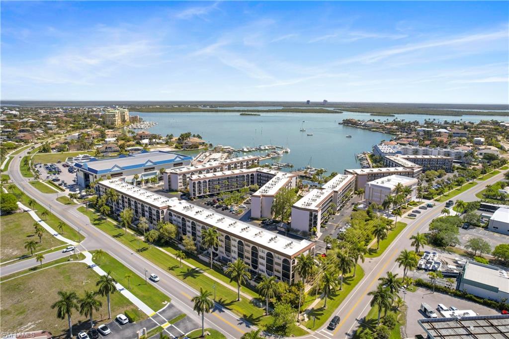 Birds eye view of property featuring a water view