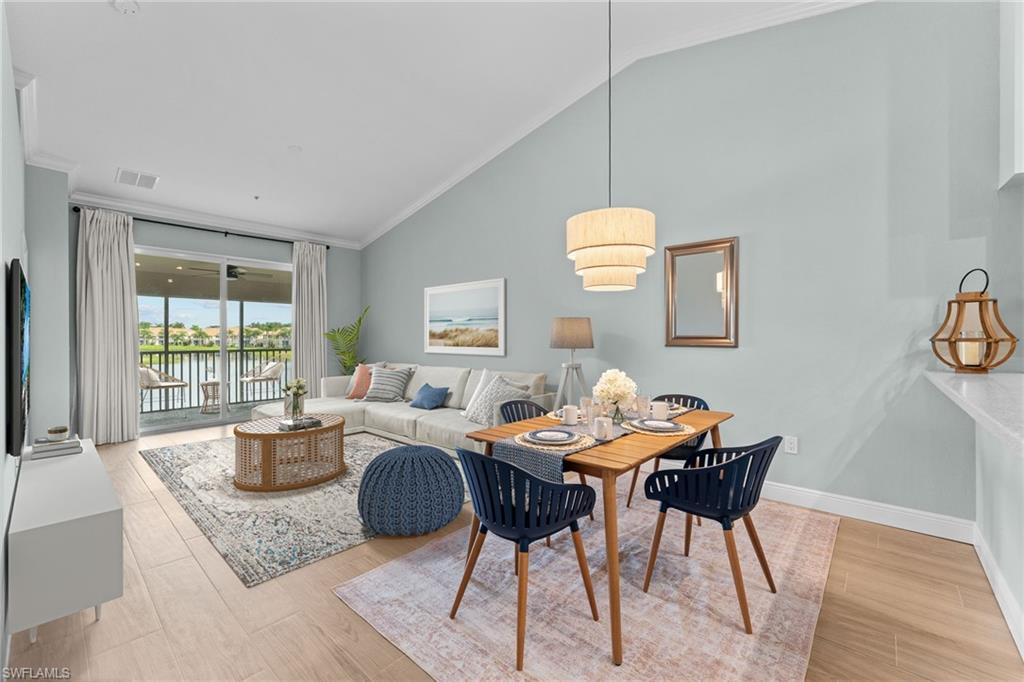 Partially Virtually Staged. Combo living / dining area with gorgeous water view. West facing - beautiful sunsets.