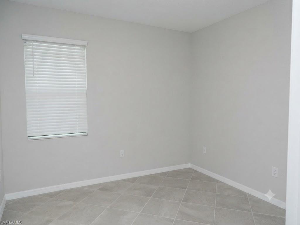 Light gray painted walls and white baseboards create a neutral interior