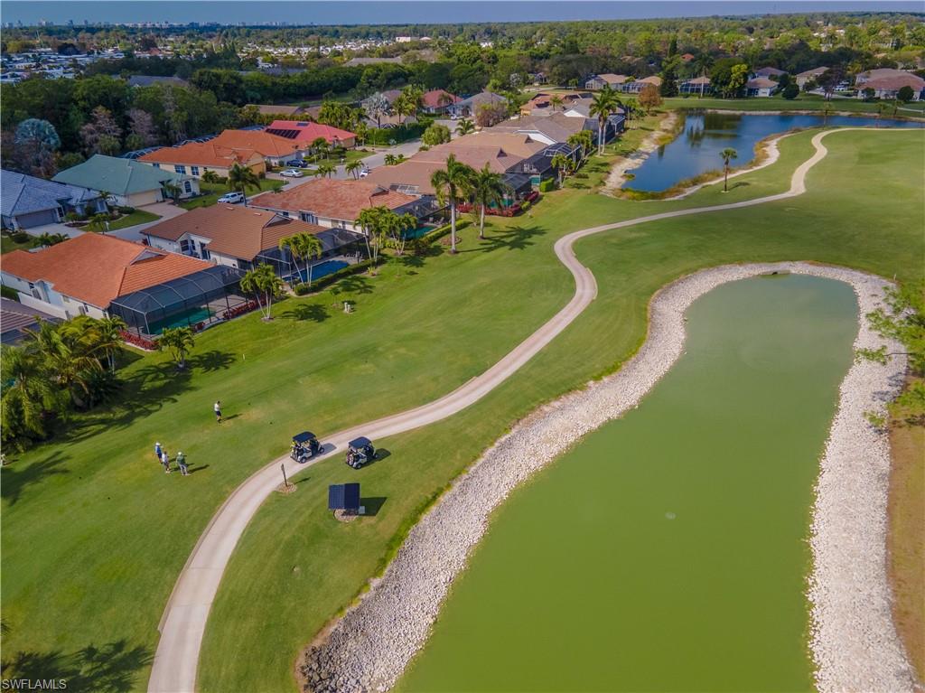 Residential community with golf course frontage, multiple water features, and established landscaping
