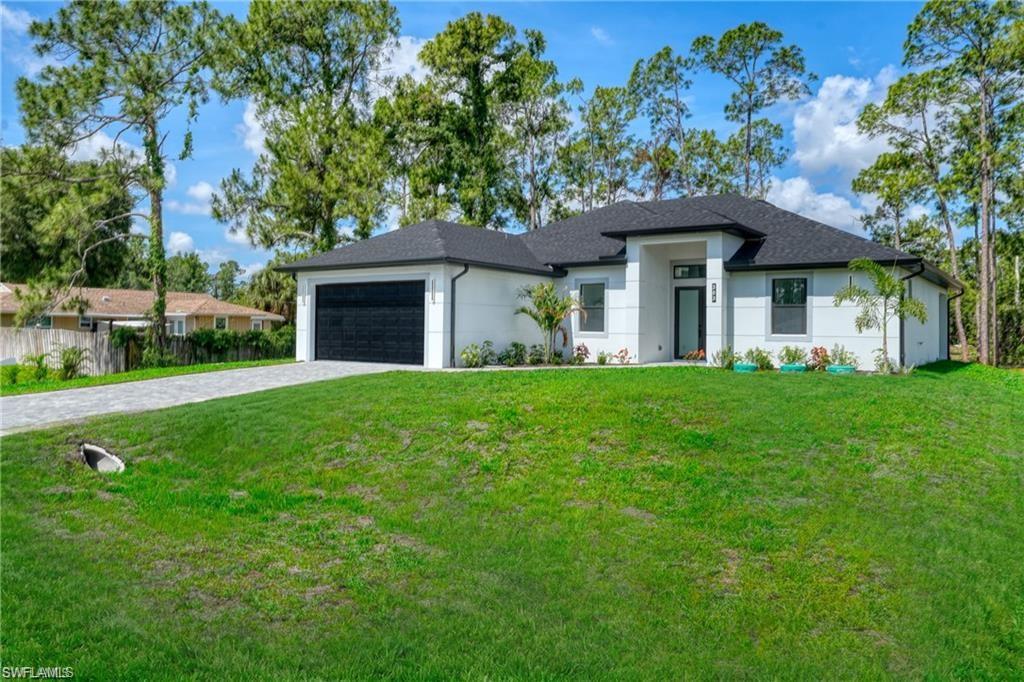 Contemporary single-story residence with a white exterior finish