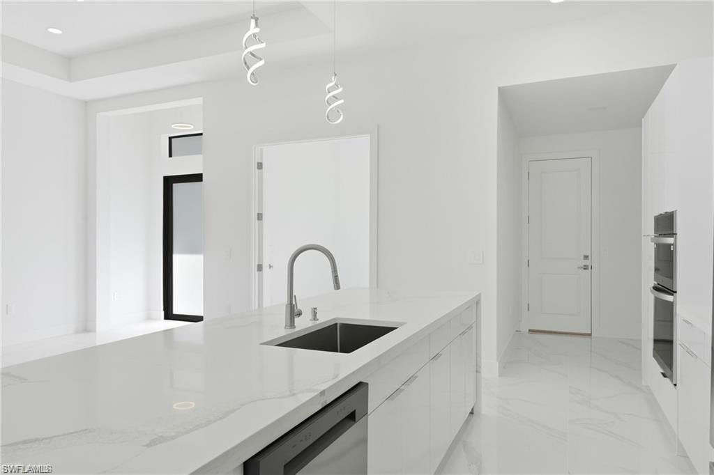 Kitchen island with integrated sink and chrome faucet