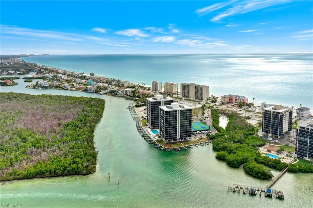 Aerial perspective showcasing coastal properties with direct water access