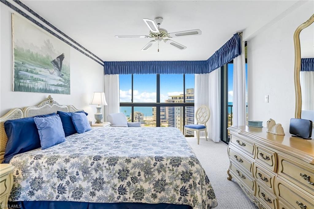 Expansive windows with blue valances and white sheer curtains
