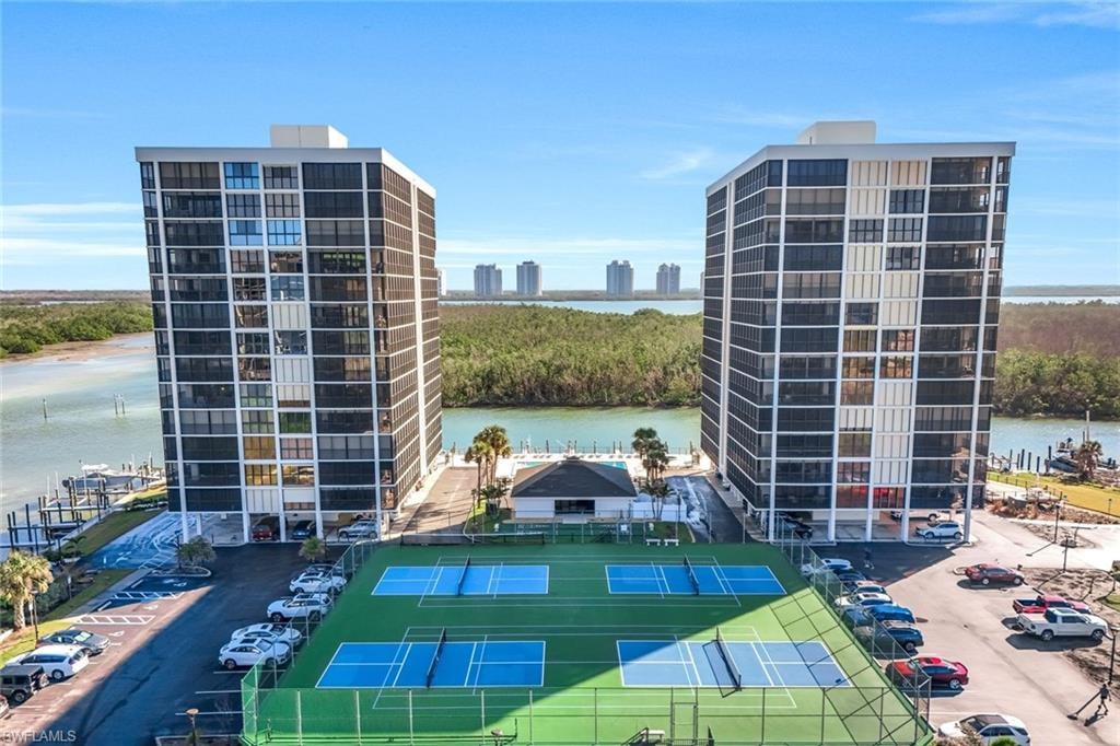 Twin high-rise residential buildings featuring private balconies and extensive water frontage