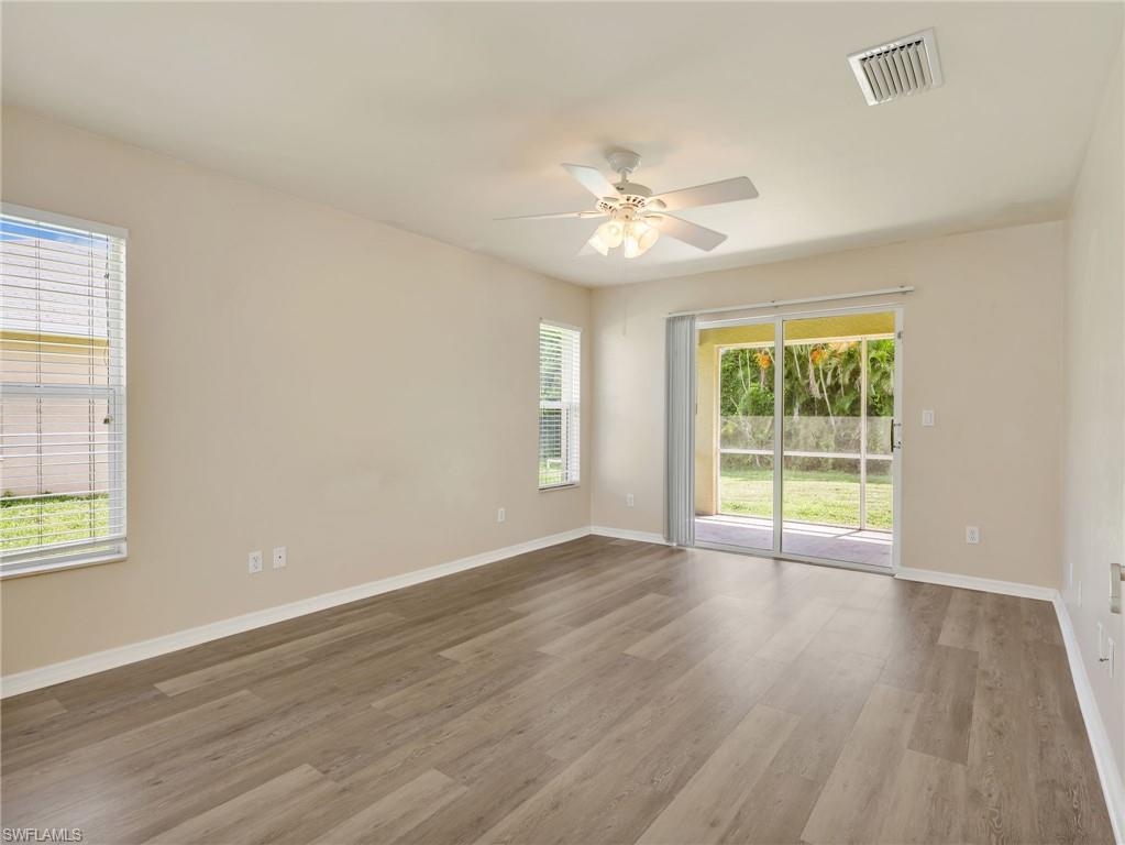 Primary Bedroom with Ceiling Fan & Vinyl Flooring