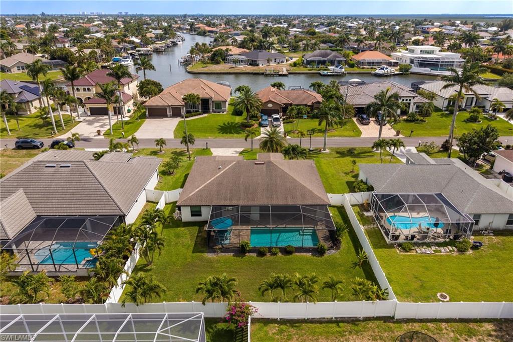 Aerial perspective showcasing residential properties with a canal system