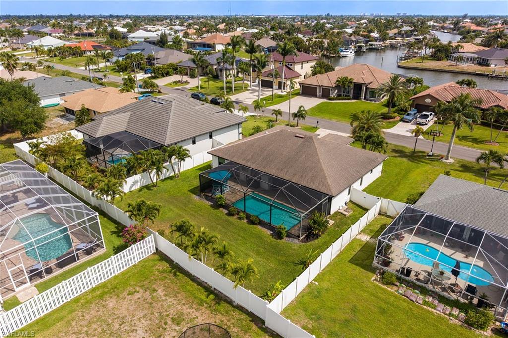 Single-story residence featuring a screened-in swimming pool
