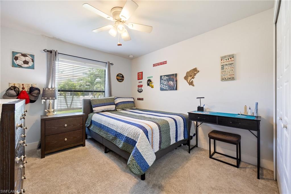 Bedroom featuring neutral wall paint and plush carpet flooring