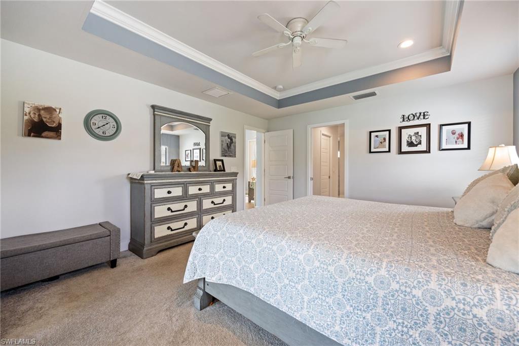 Recessed ceiling with blue accent paint and crown molding
