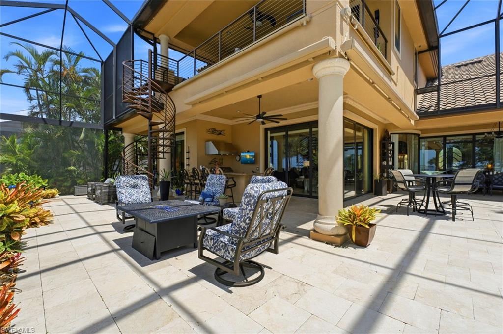 Retractable awnings on both sides of the expansive lanai provide effortless shade and protection from the elements, creating a more comfortable and versatile outdoor living environment for year-round enjoyment.