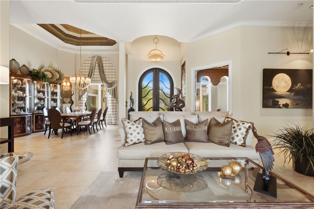 As you enter this extraordinary masterpiece through its custom double front doors, you are immediately captivated by the breathtaking river views that unfold before you, creating a truly awe-inspiring first impression.