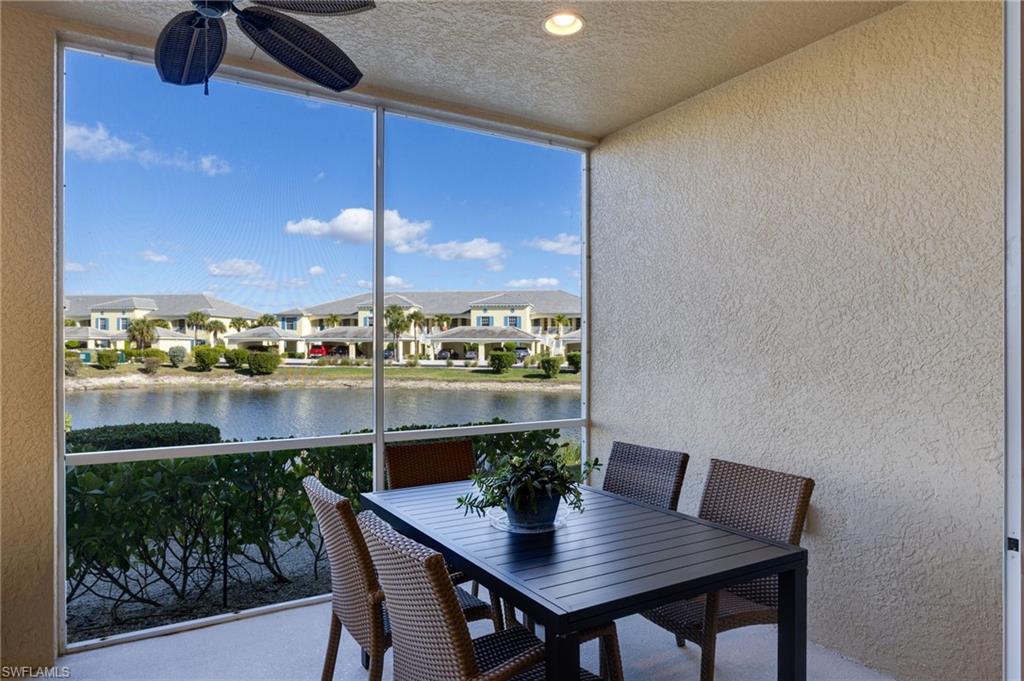 Screened patio with a ceiling fan and recessed lighting