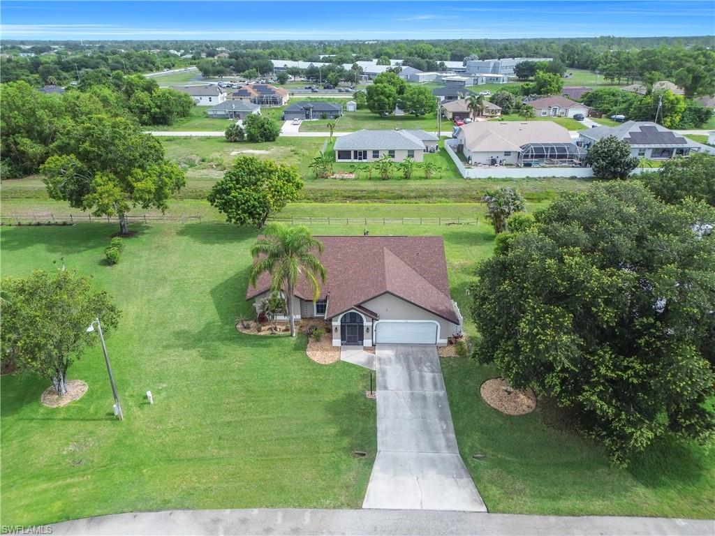 Single-story residence with an attached garage and a concrete driveway