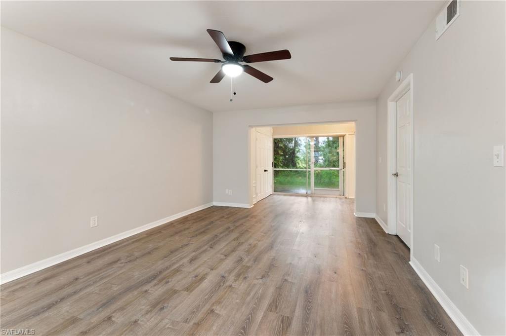 28230 Pine Haven Way #66 Bonita Springs FL 34135 - Ceiling fan with light highlights living area
