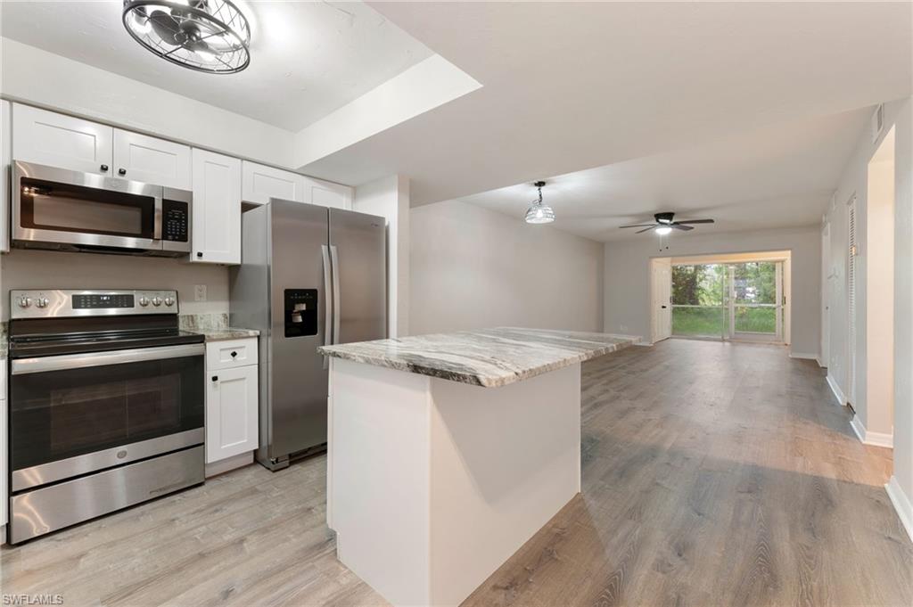 28230 Pine Haven Way #66 Bonita Springs FL 34135 - Opened kitchen layout with re-faced cabinets and work/dining island