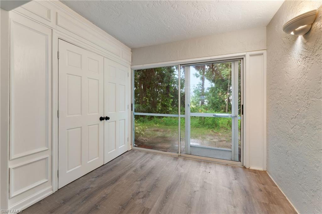 28230 Pine Haven Way #66 Bonita Springs FL 34135 - Enclosed lanai area with access to washer, dryer, and water heater.