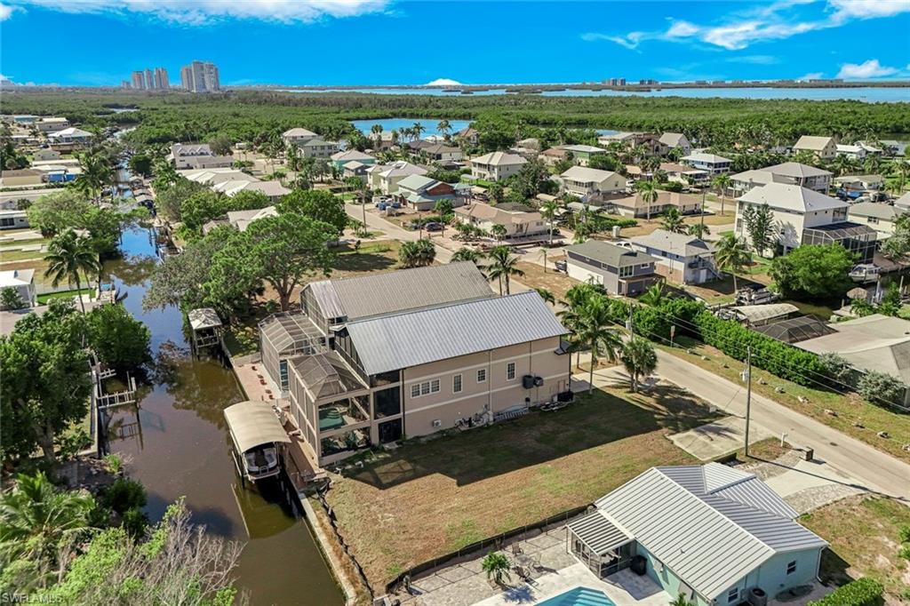 Aerial view of residential area with a large body of water