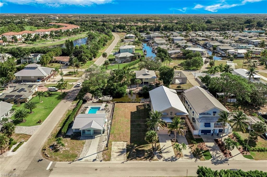 Aerial view of residential area featuring a large body of water