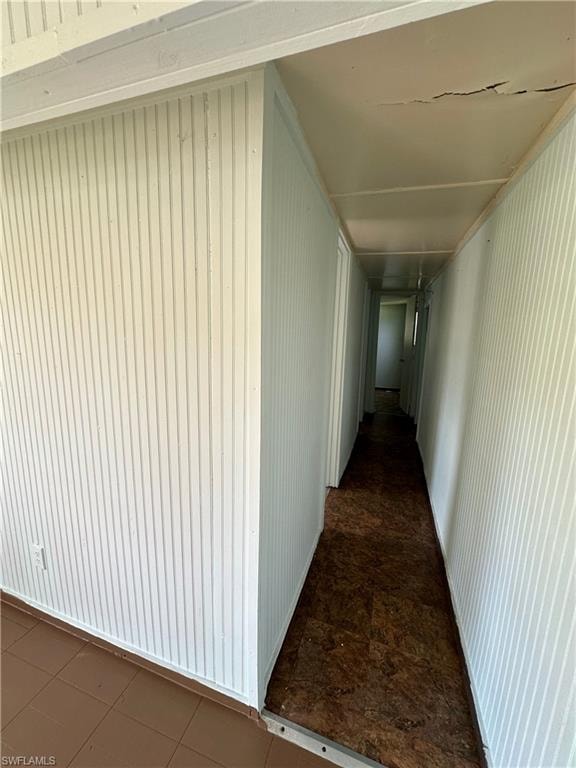 Corridor featuring tile patterned floors